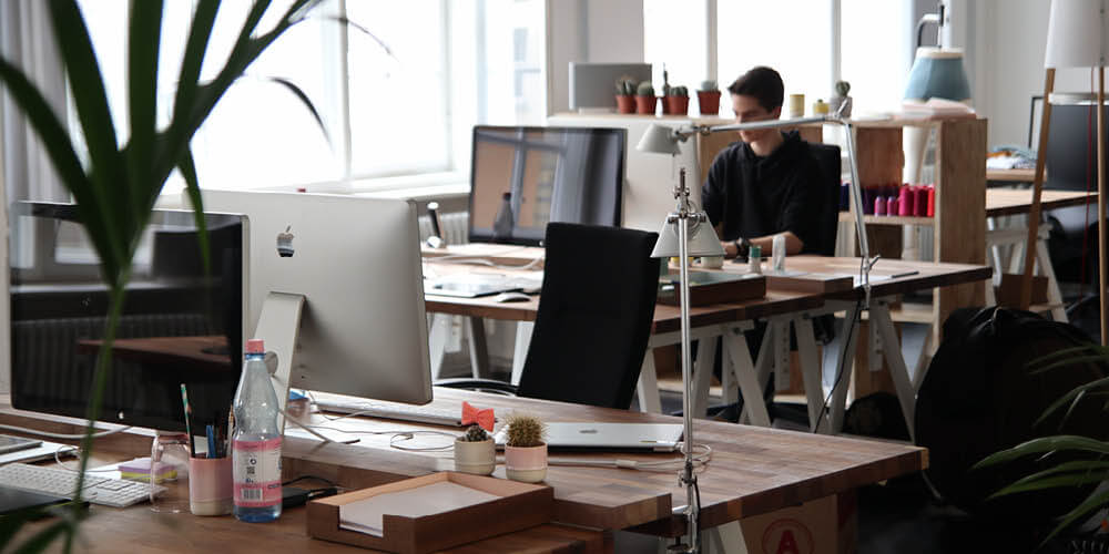an office worker sat at his desk